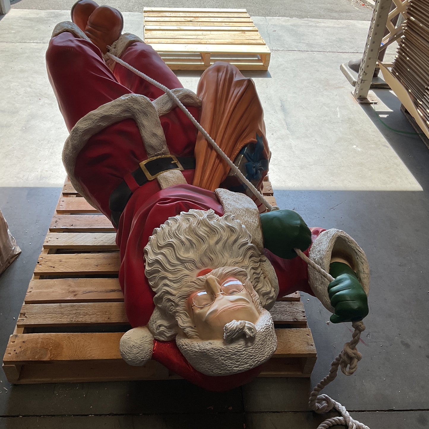 Santa On Rope Statue