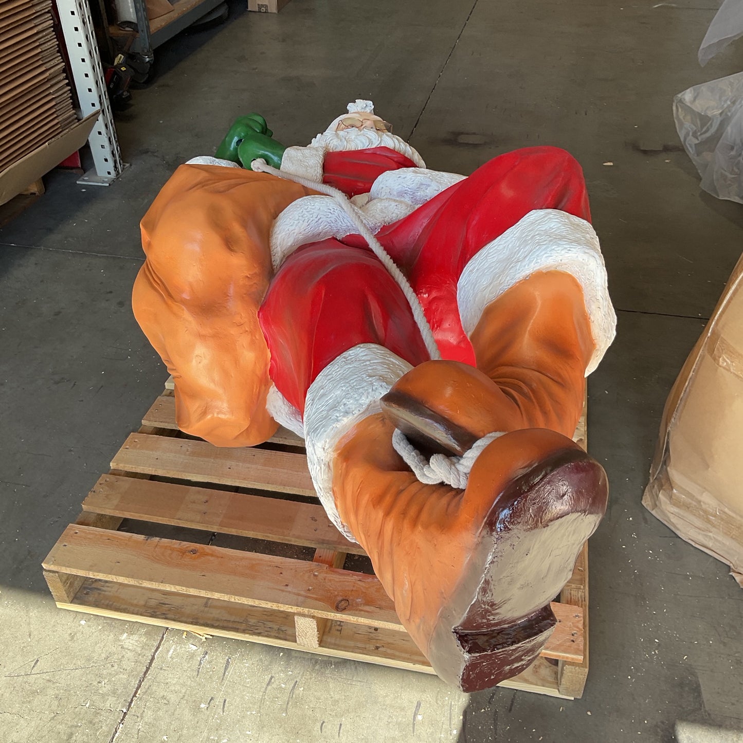 Santa On Rope Statue