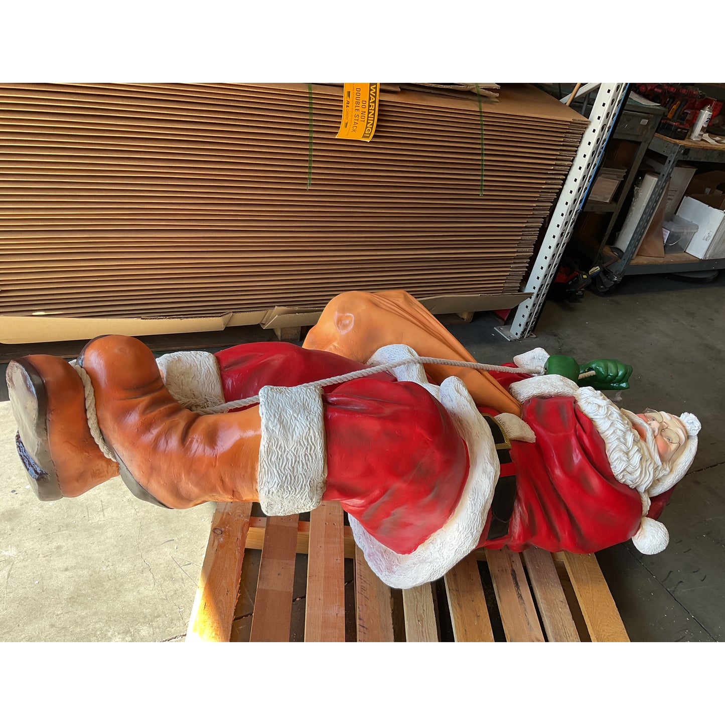 Santa On Rope Statue