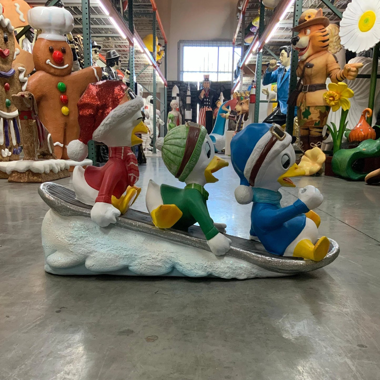 Small Ducklings On Snowboard Statue