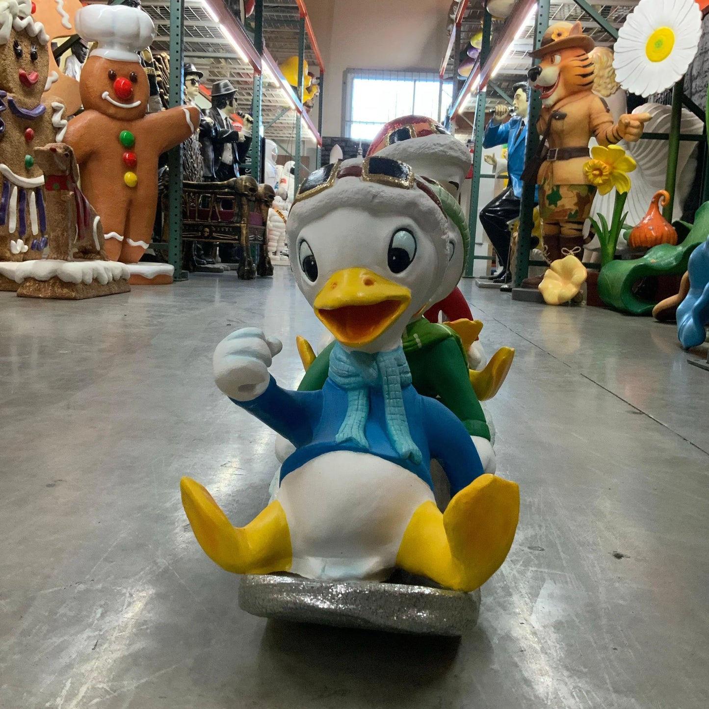 Small Ducklings On Snowboard Statue
