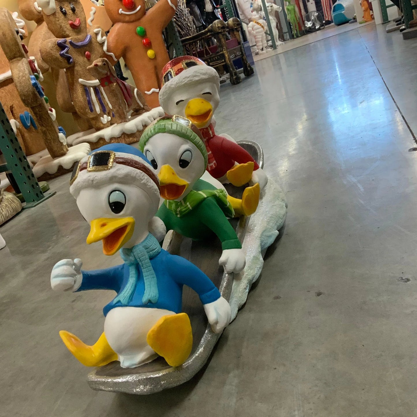 Small Ducklings On Snowboard Statue