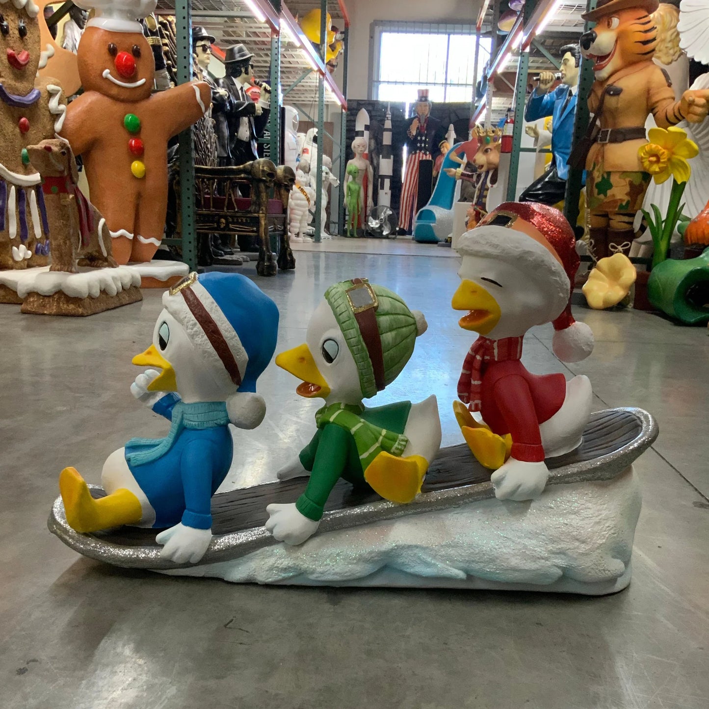 Small Ducklings On Snowboard Statue