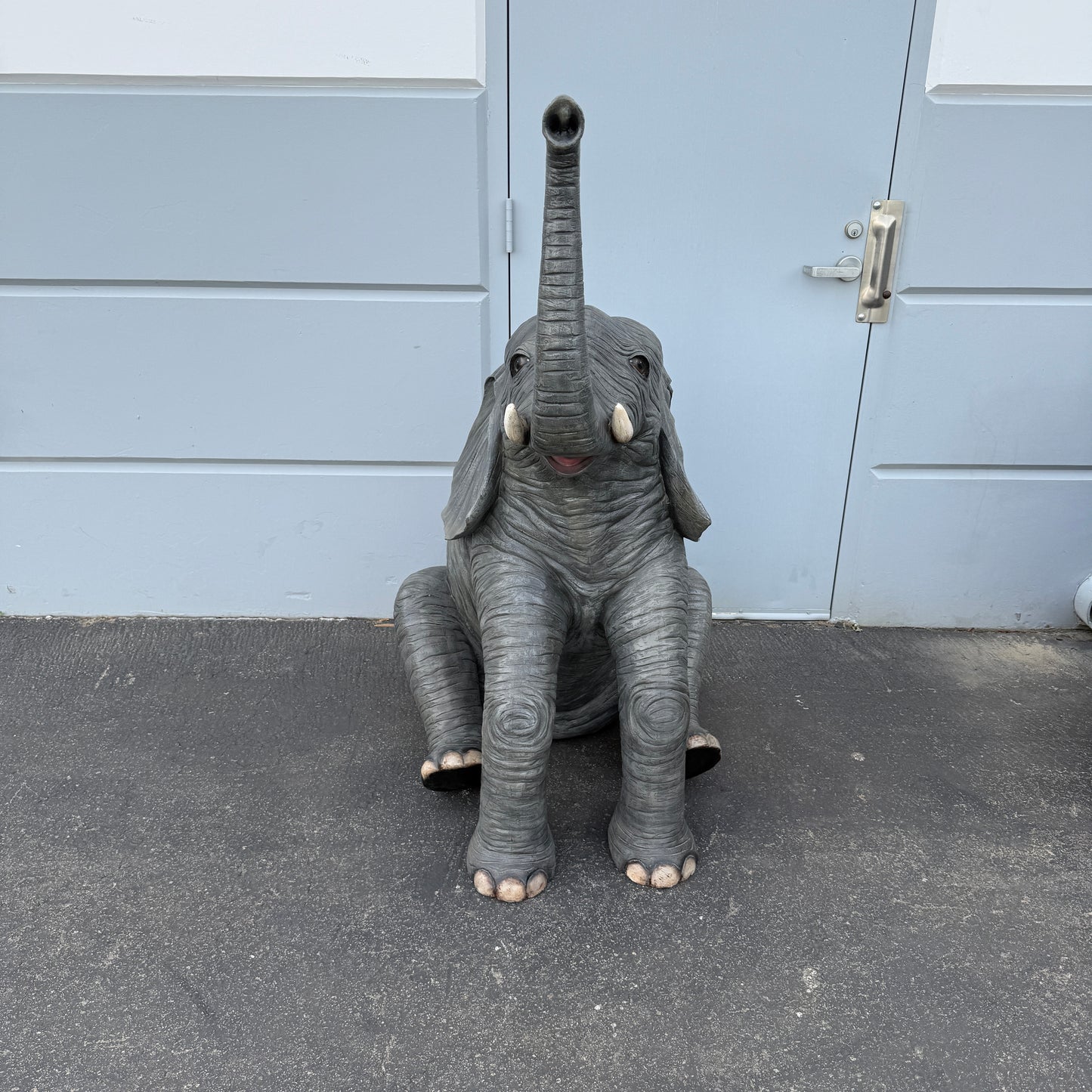 Sitting Elephant Trunk Up Statue