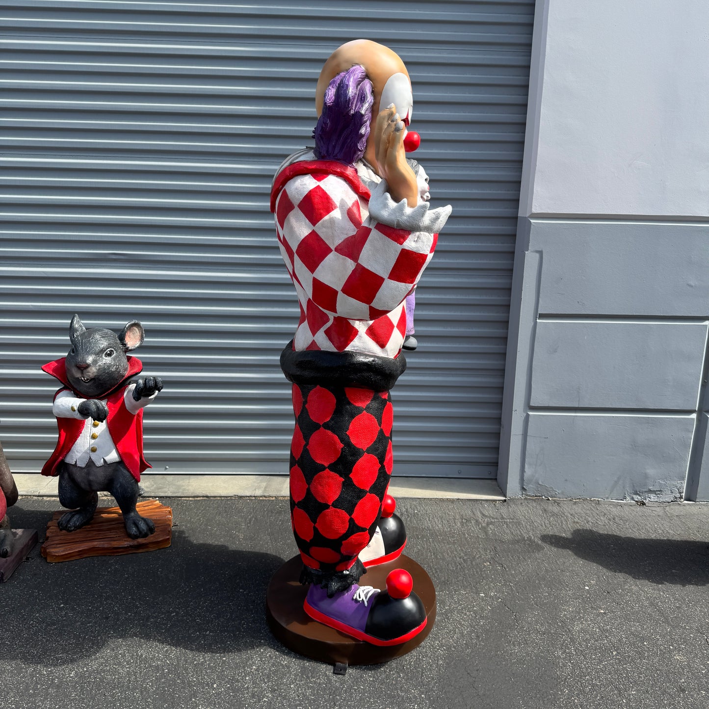Jester Clown With Doll Statue