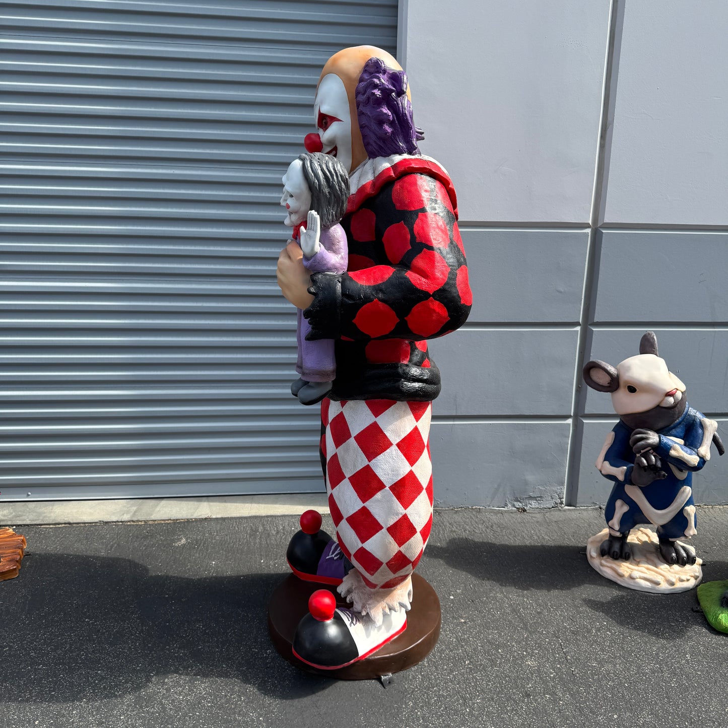 Jester Clown With Doll Statue