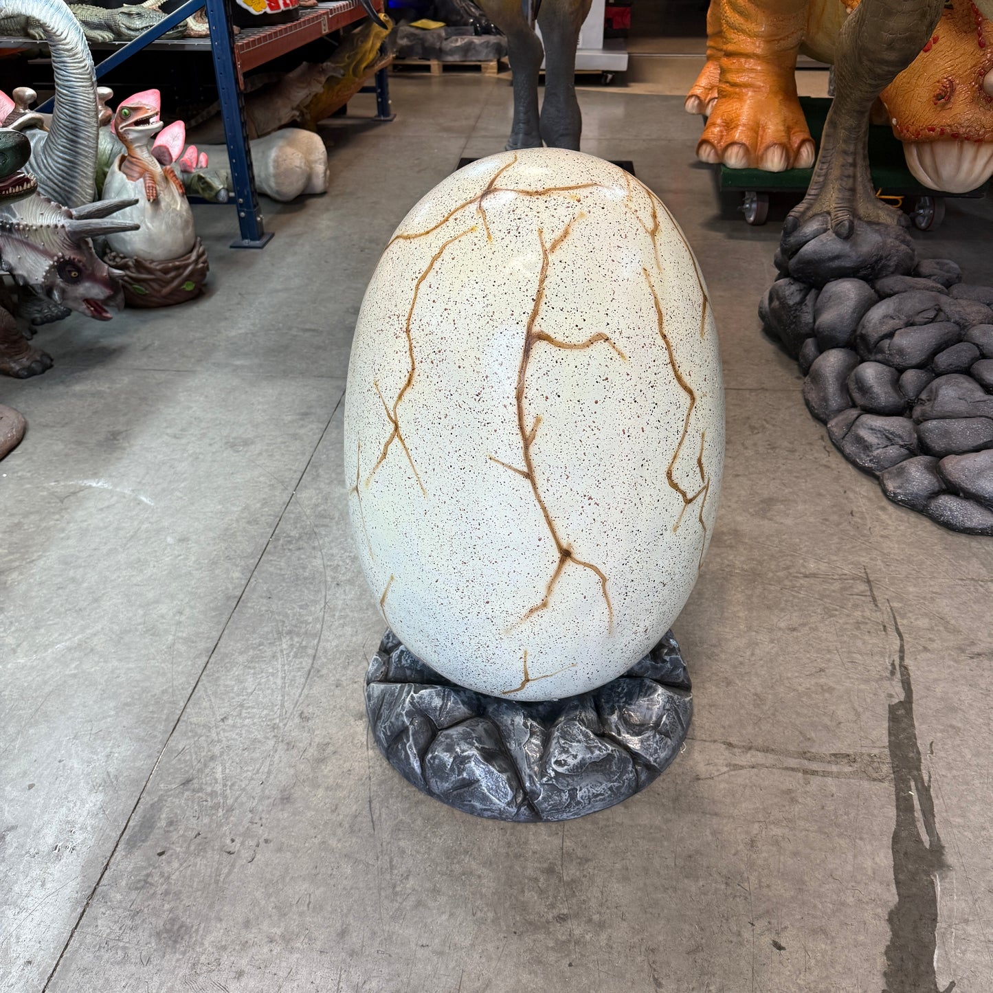 Large Dinosaur Egg On Rock Statue