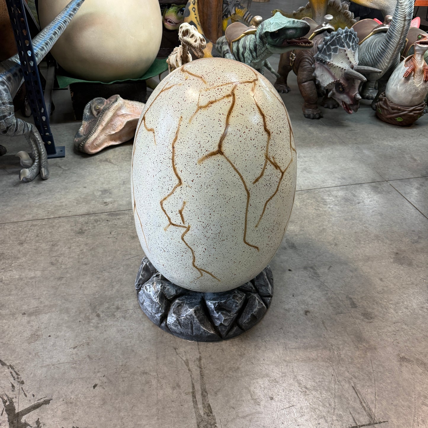 Large Dinosaur Egg On Rock Statue
