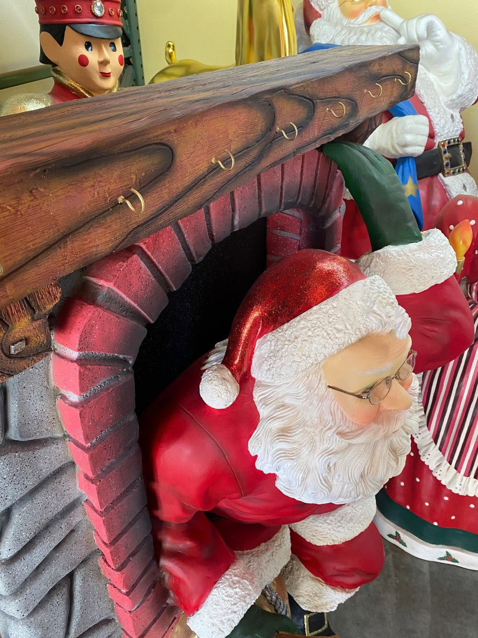 Santa Climbing Chimney Statue