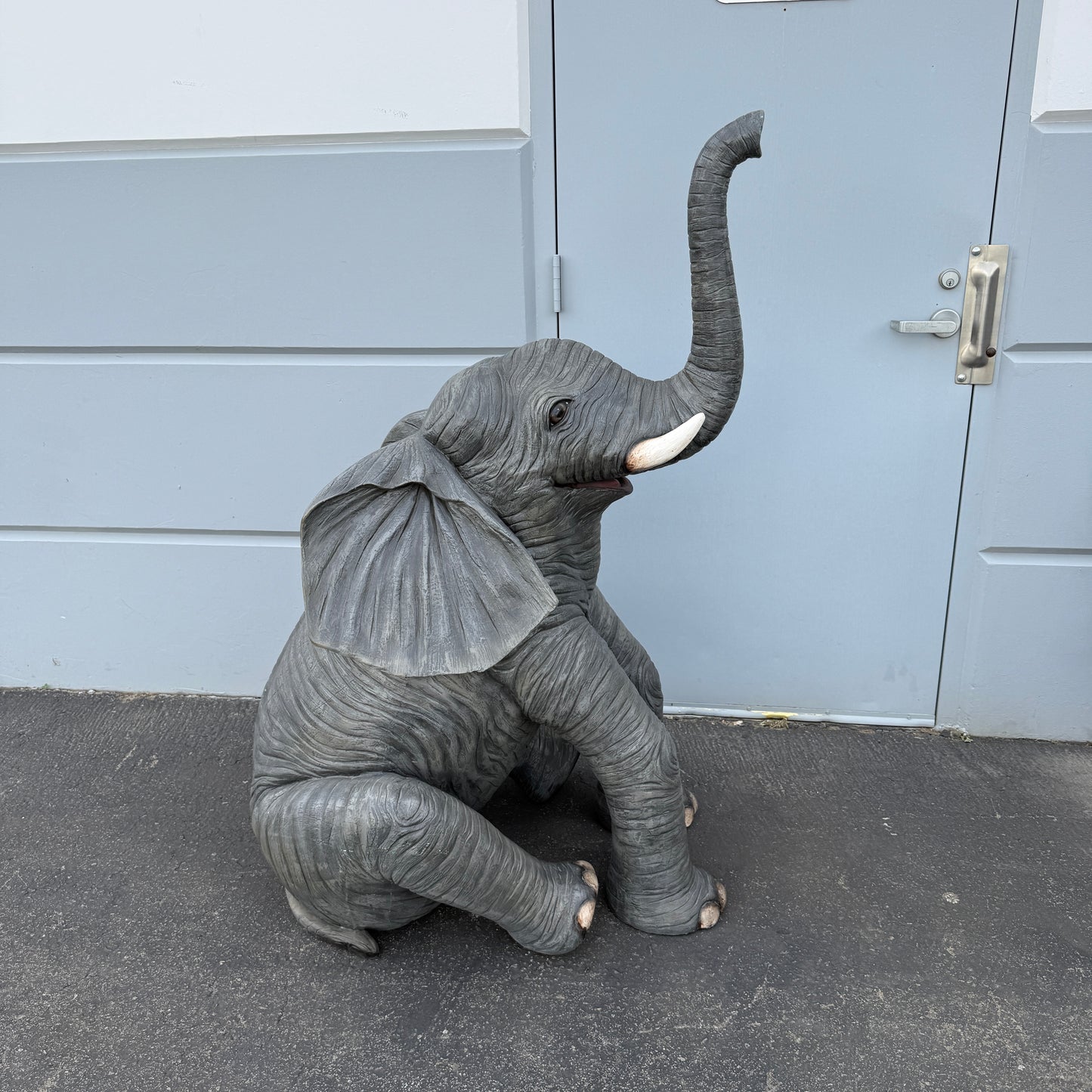 Sitting Elephant Trunk Up Statue