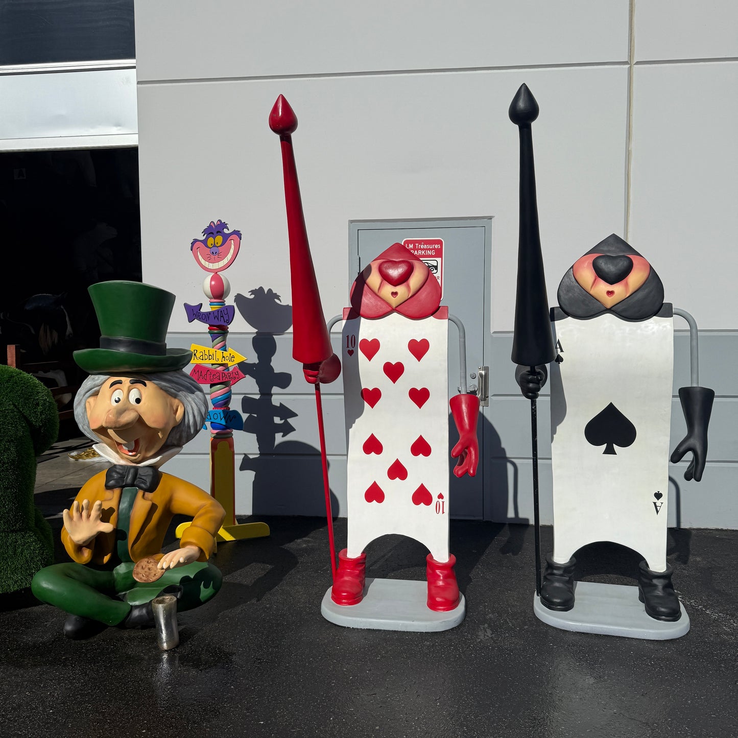 Single Red Playing Card With Staff Statue