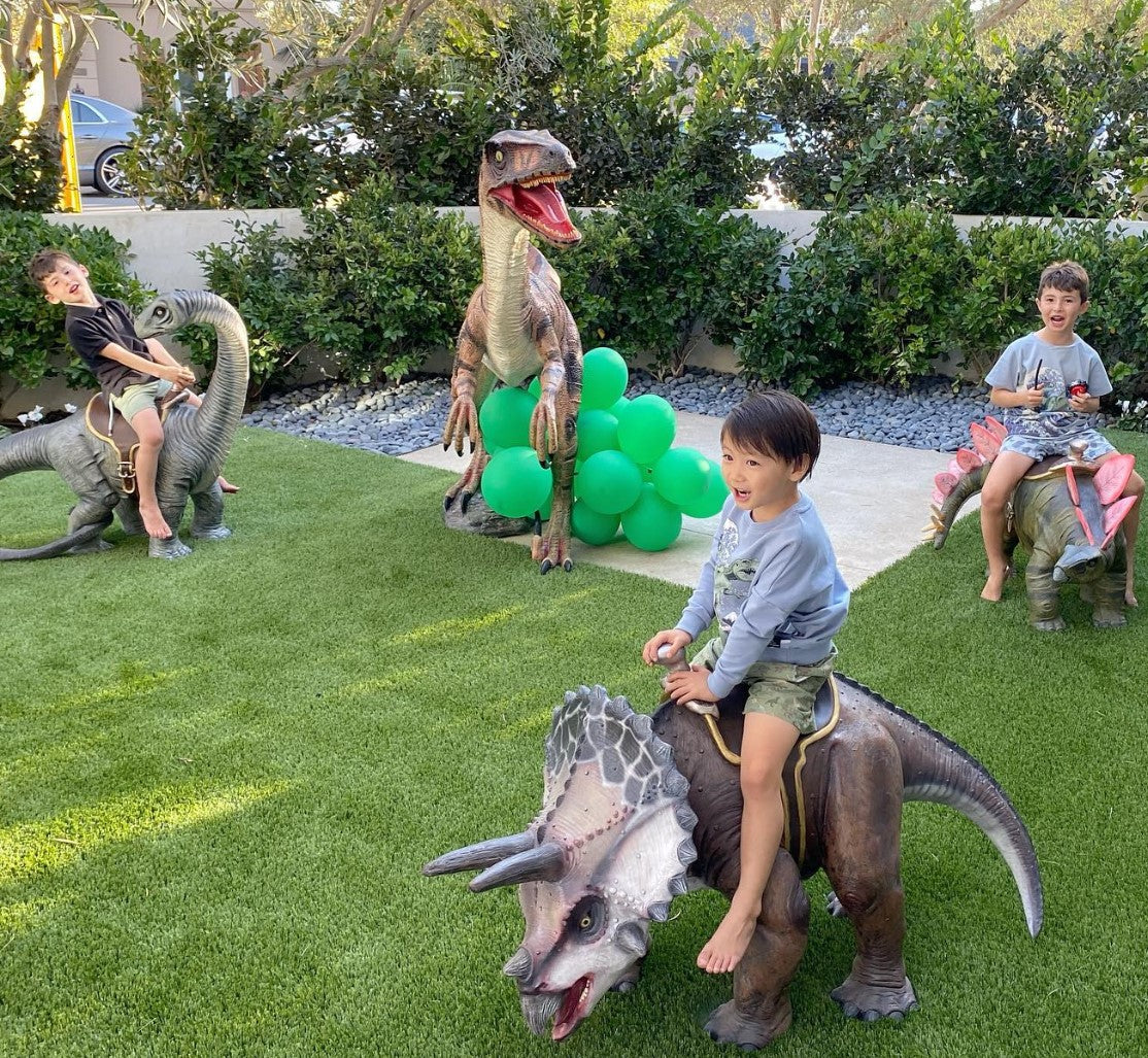 Small Brown Triceratops Dinosaur With Saddle Statue