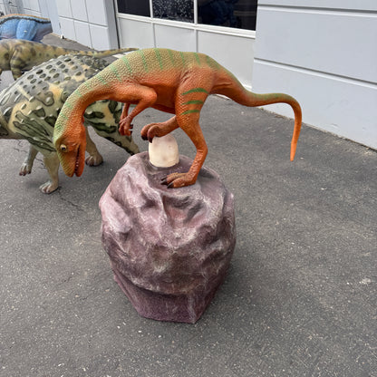 Compsognathus Dinosaur On Rock Statue