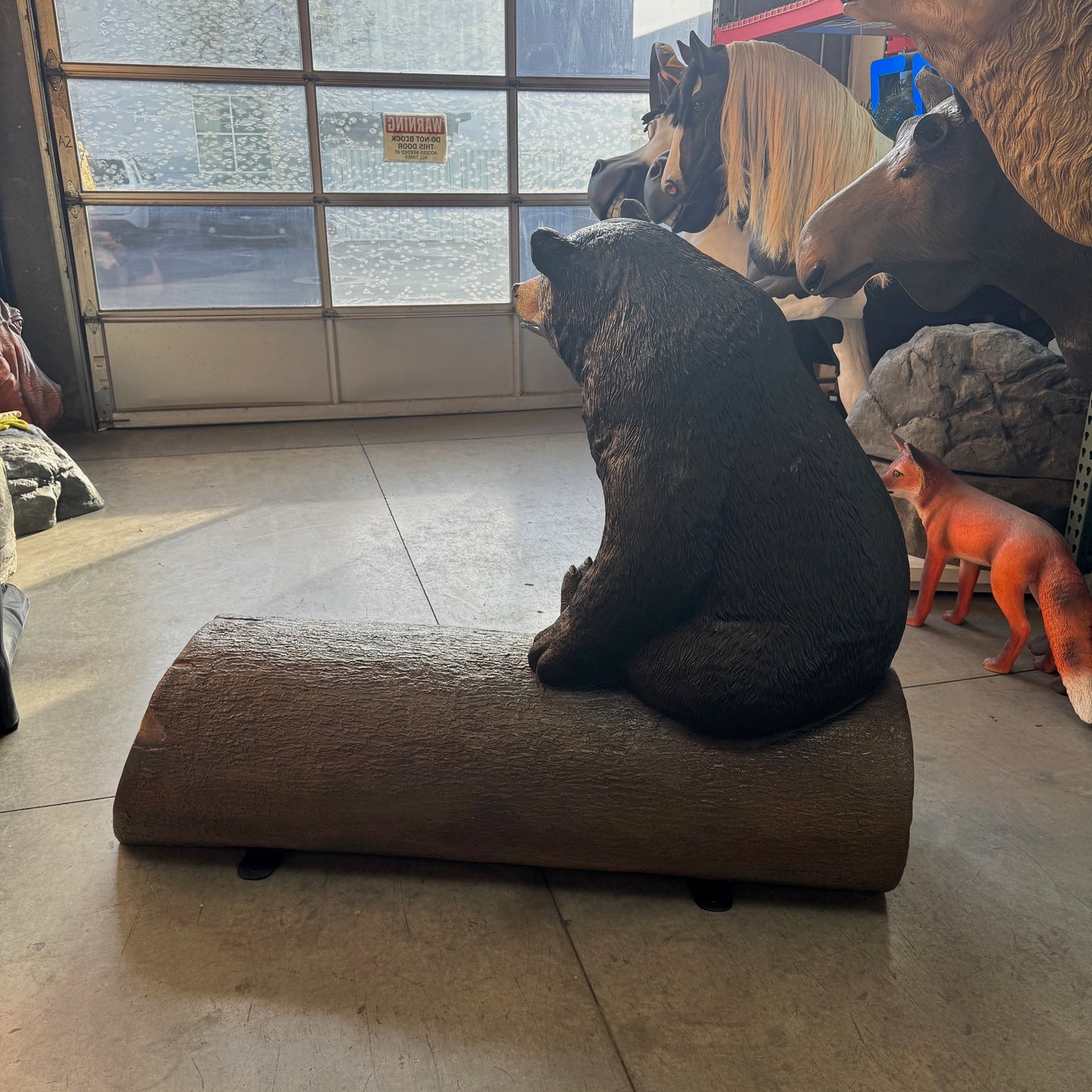 Black Bear on Tree Trunk Statue