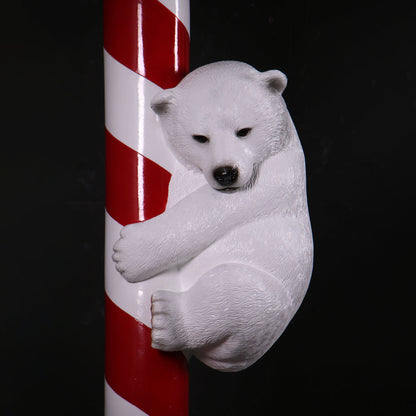 Polar Bear Cubs on Candy Cane Statue