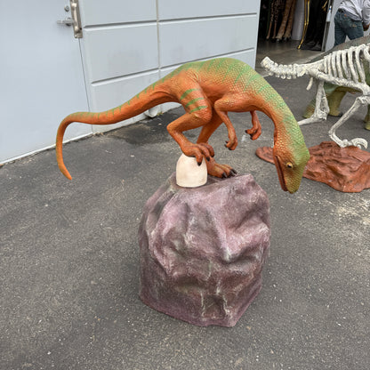 Compsognathus Dinosaur On Rock Statue