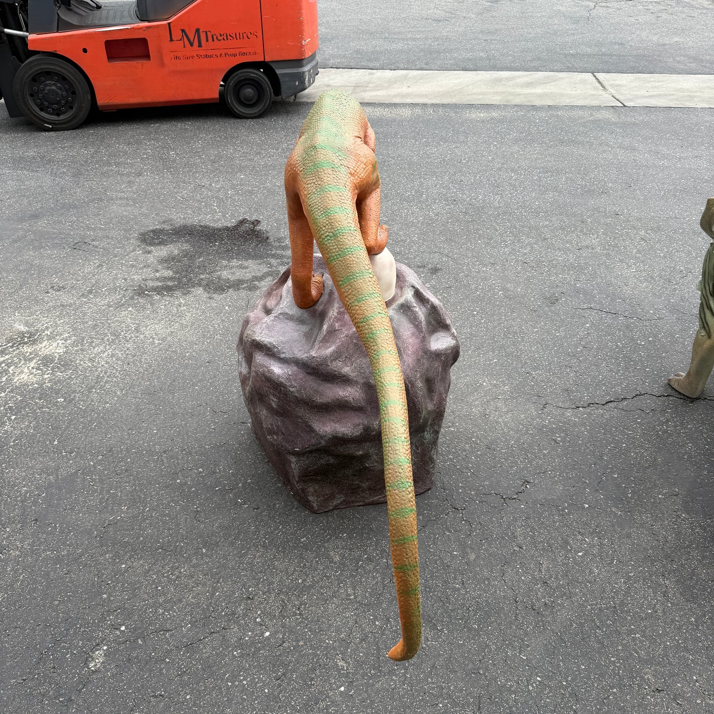 Compsognathus Dinosaur On Rock Statue