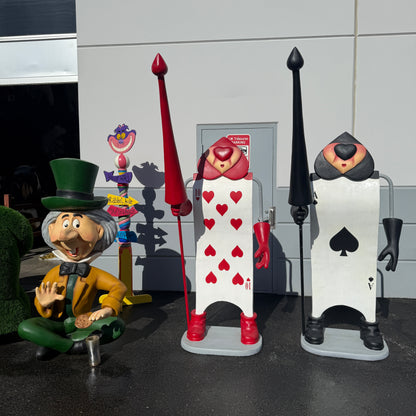 Single Black Playing Card With Staff Statue
