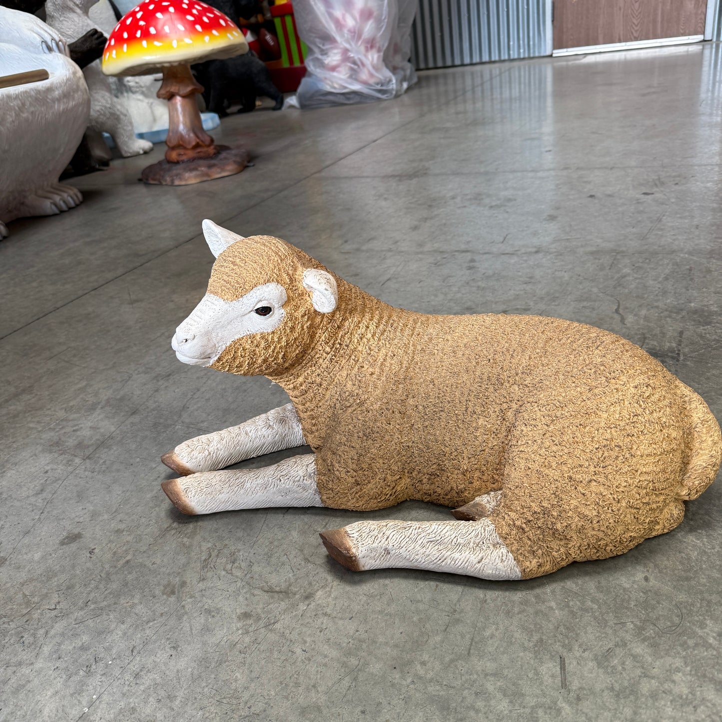 Baby Laying Merino Lamb Statue