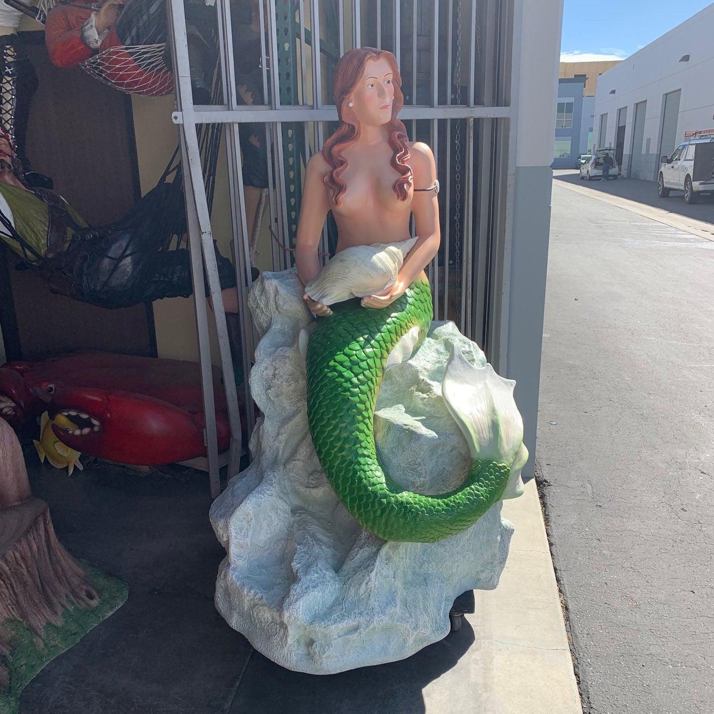 Mermaid Sitting On Rock Statue