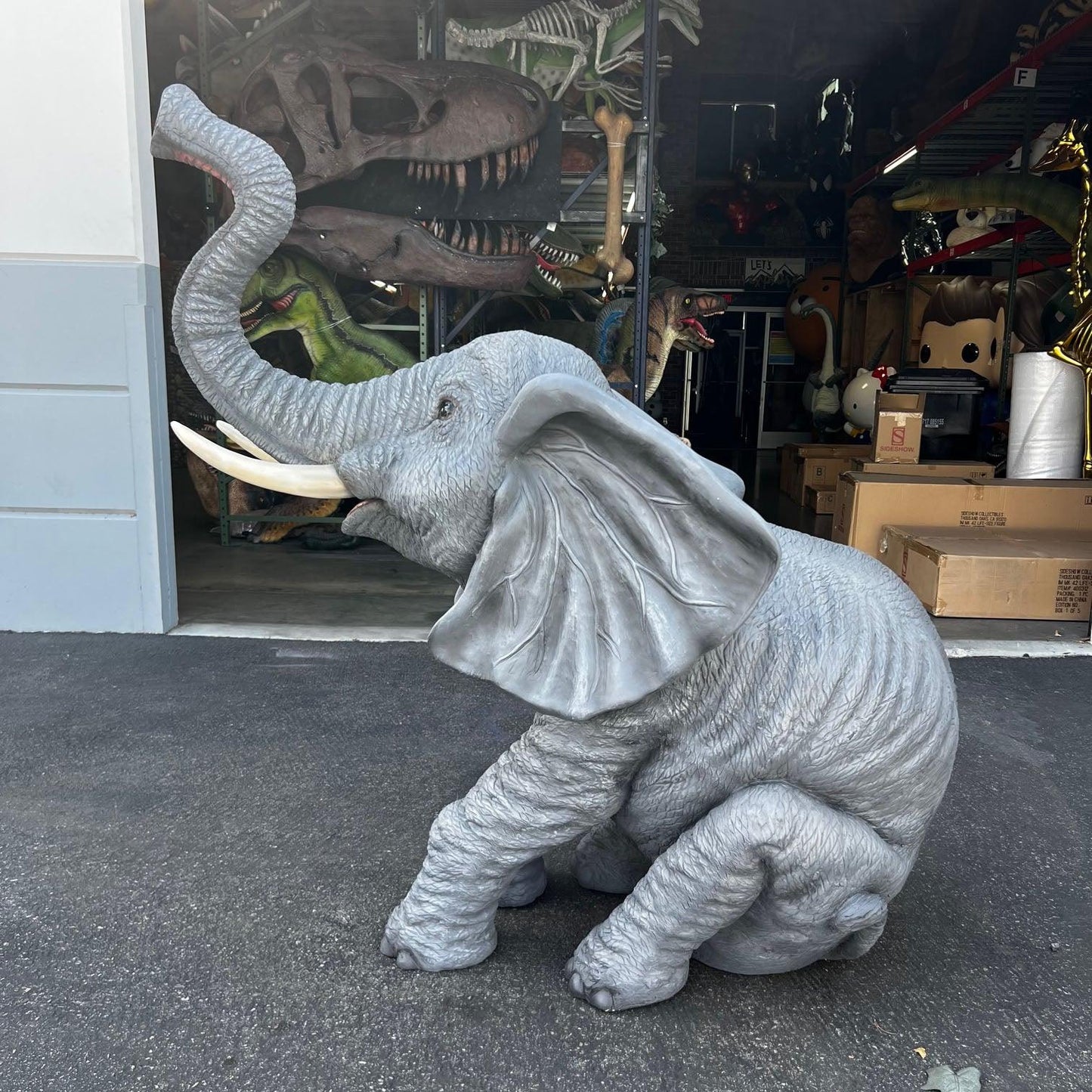 Sitting Elephant With Tusks Statue