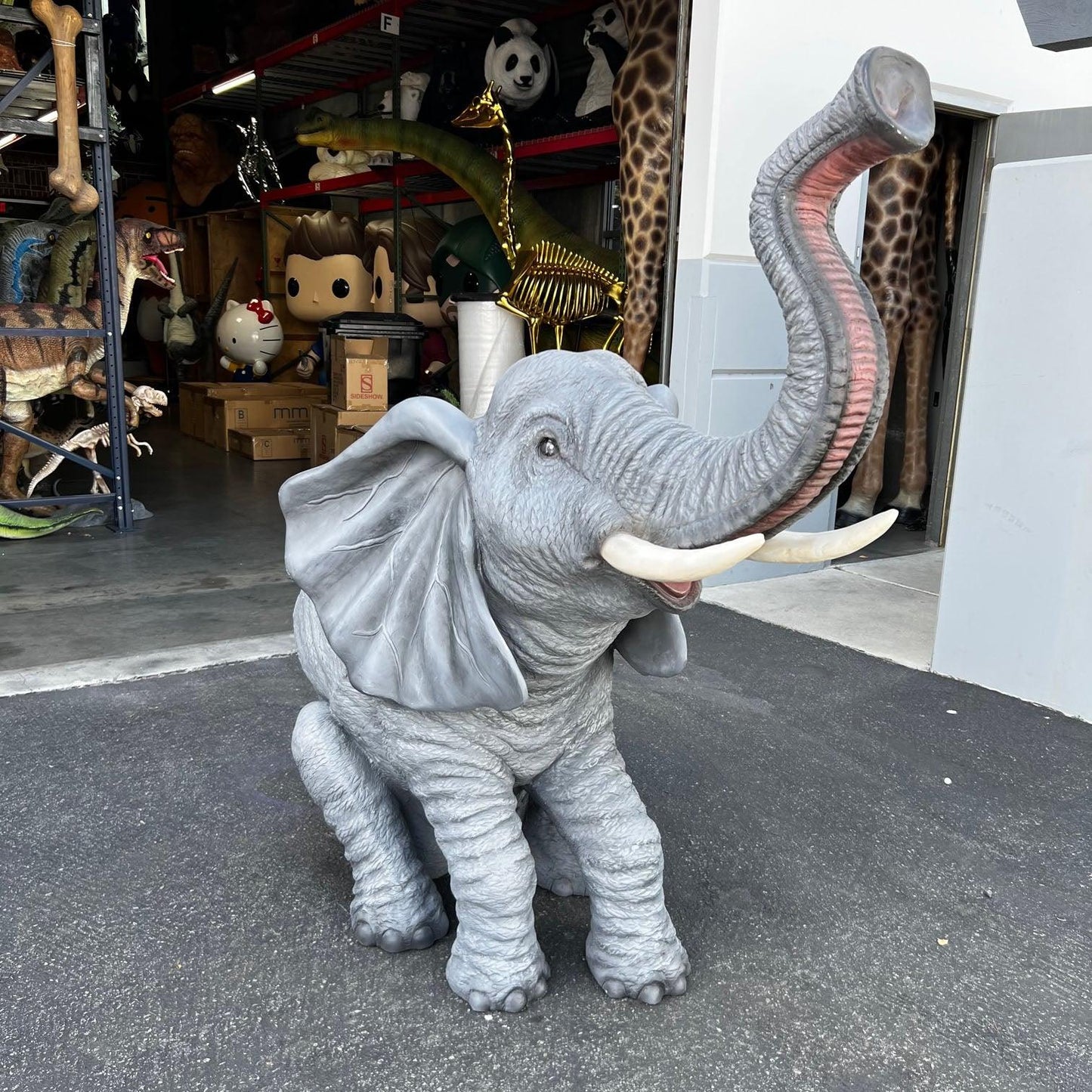 Sitting Elephant With Tusks Statue