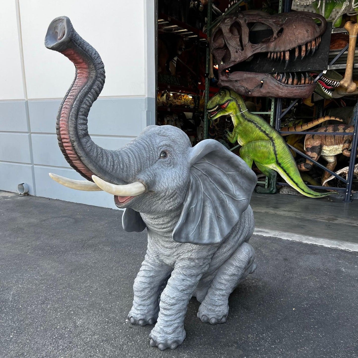 Sitting Elephant With Tusks Statue