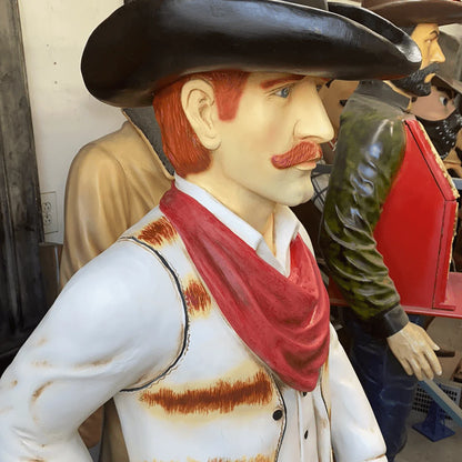 Western Cowboy With Saddle Statue