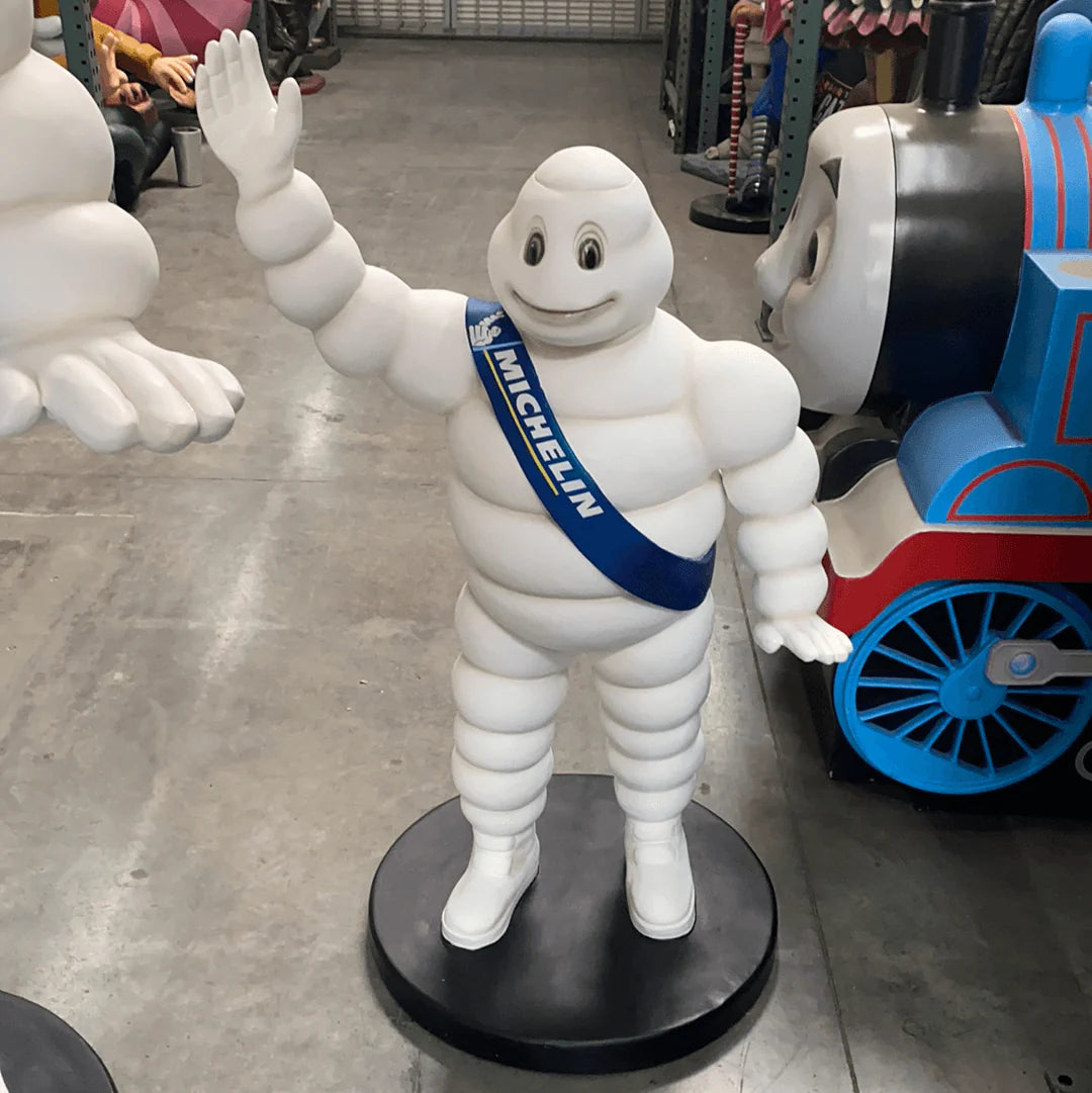 Tire Man Waving Small Statue