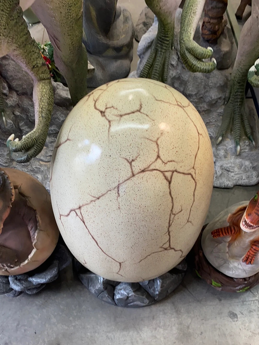 Large Dinosaur Egg On Rock Statue