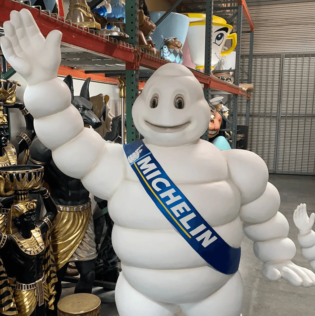 Tire Man Waving Life Size Statue