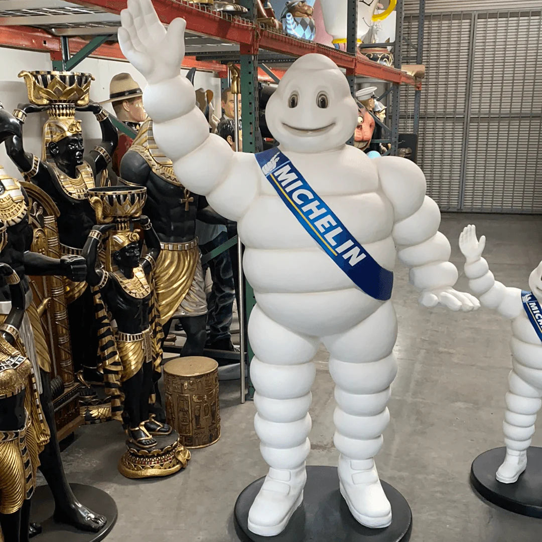 Tire Man Waving Life Size Statue