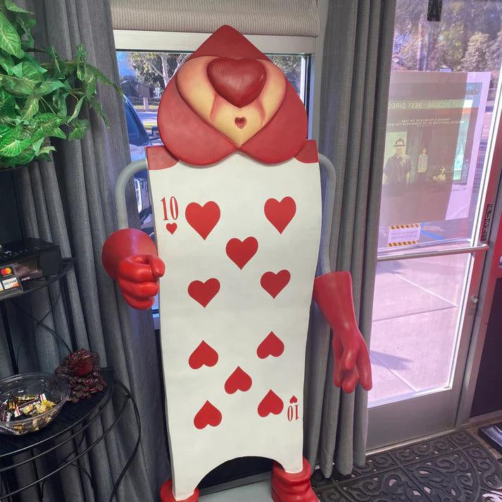 Single Red Playing Card With Staff Statue