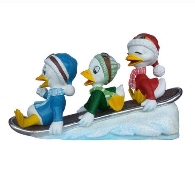 Small Ducklings On Snowboard Statue
