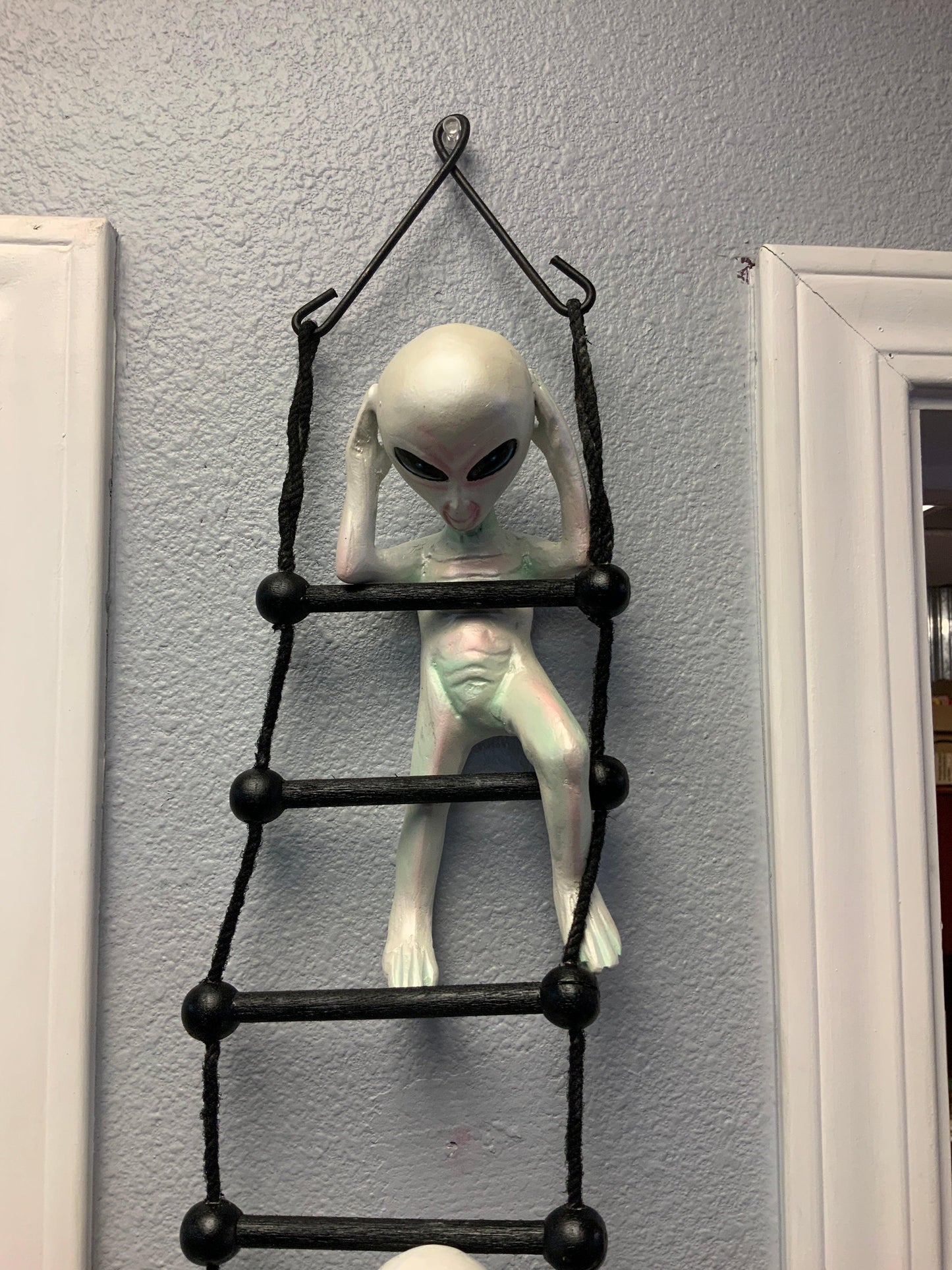 Alien on Rope Ladder Statue