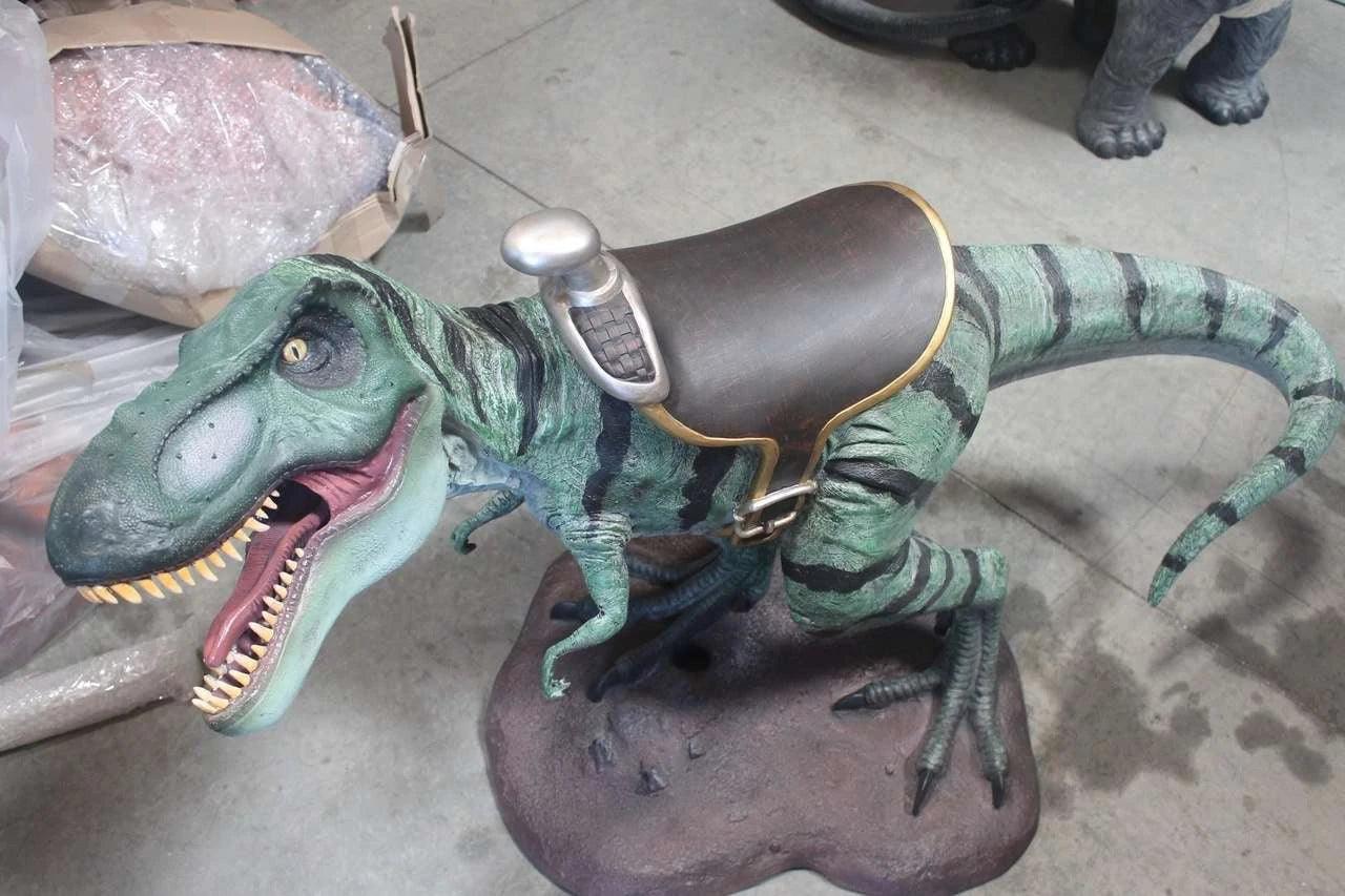 Small T-Rex Dinosaur With Saddle Statue
