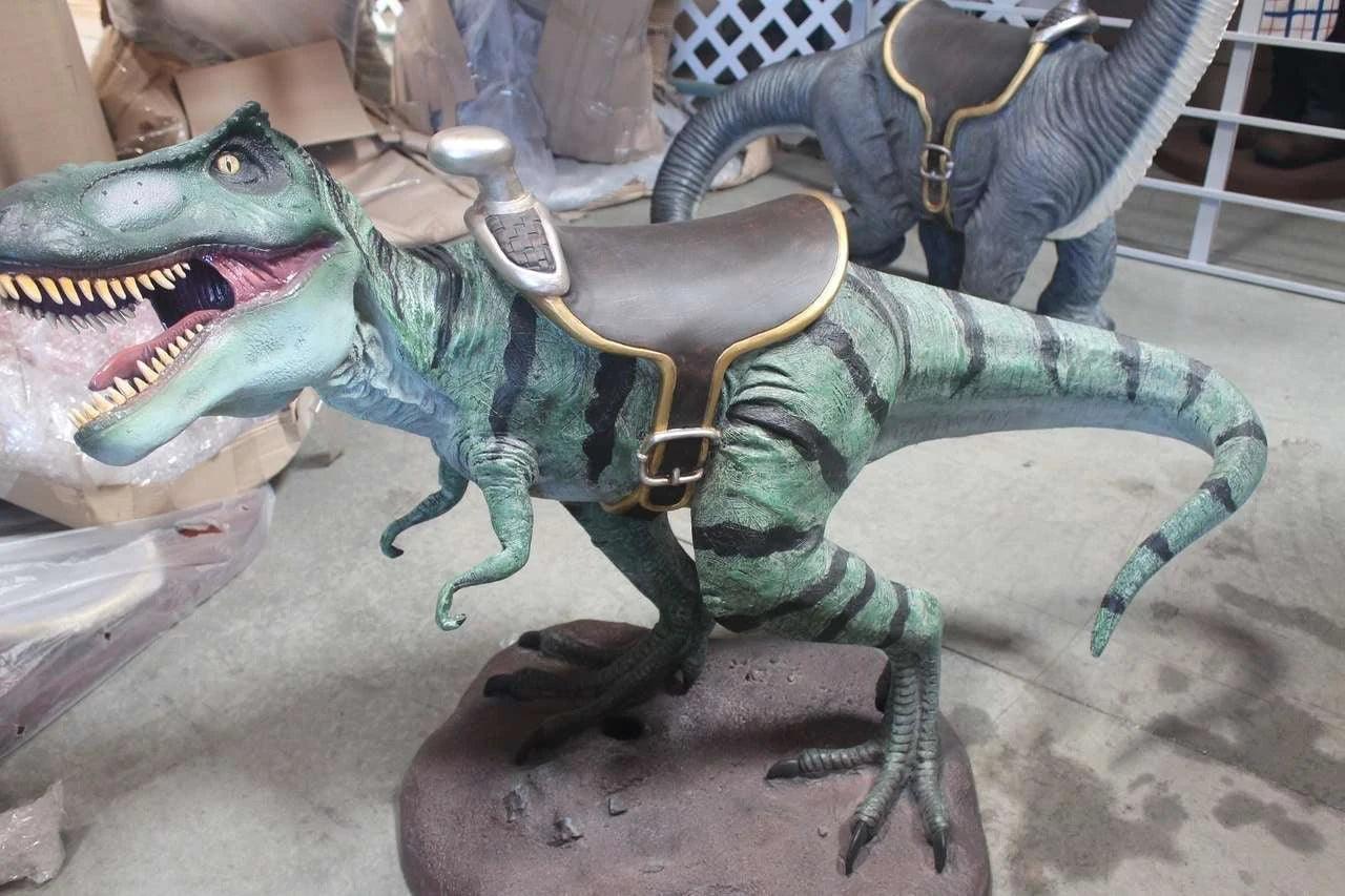 Small T-Rex Dinosaur With Saddle Statue