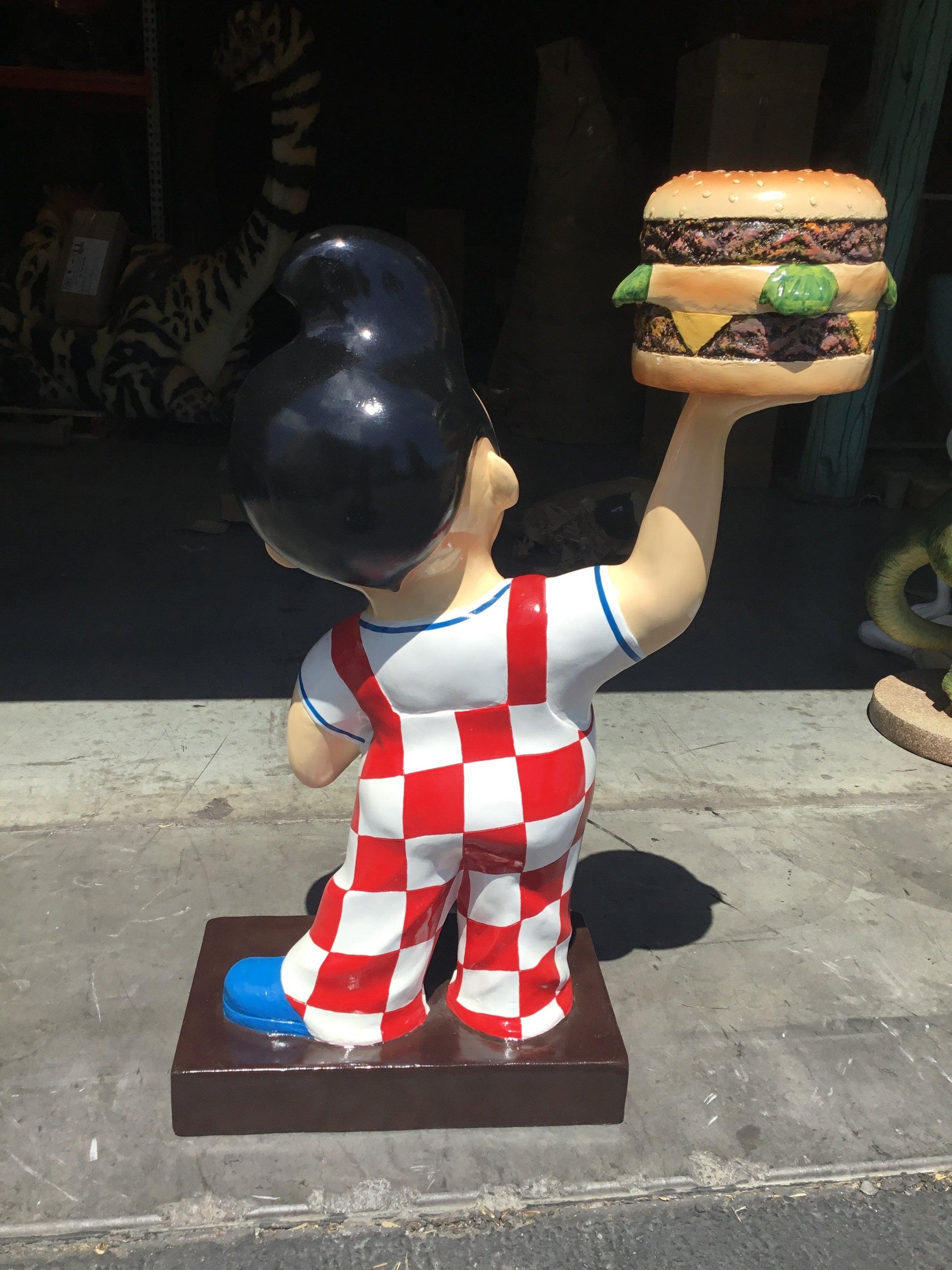Small Boy With Hamburger Statue - LM Treasures Prop Rentals 